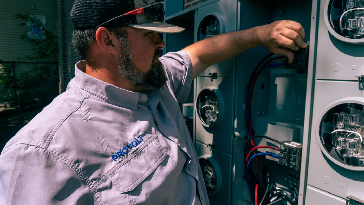 Electrician working on a meter panel