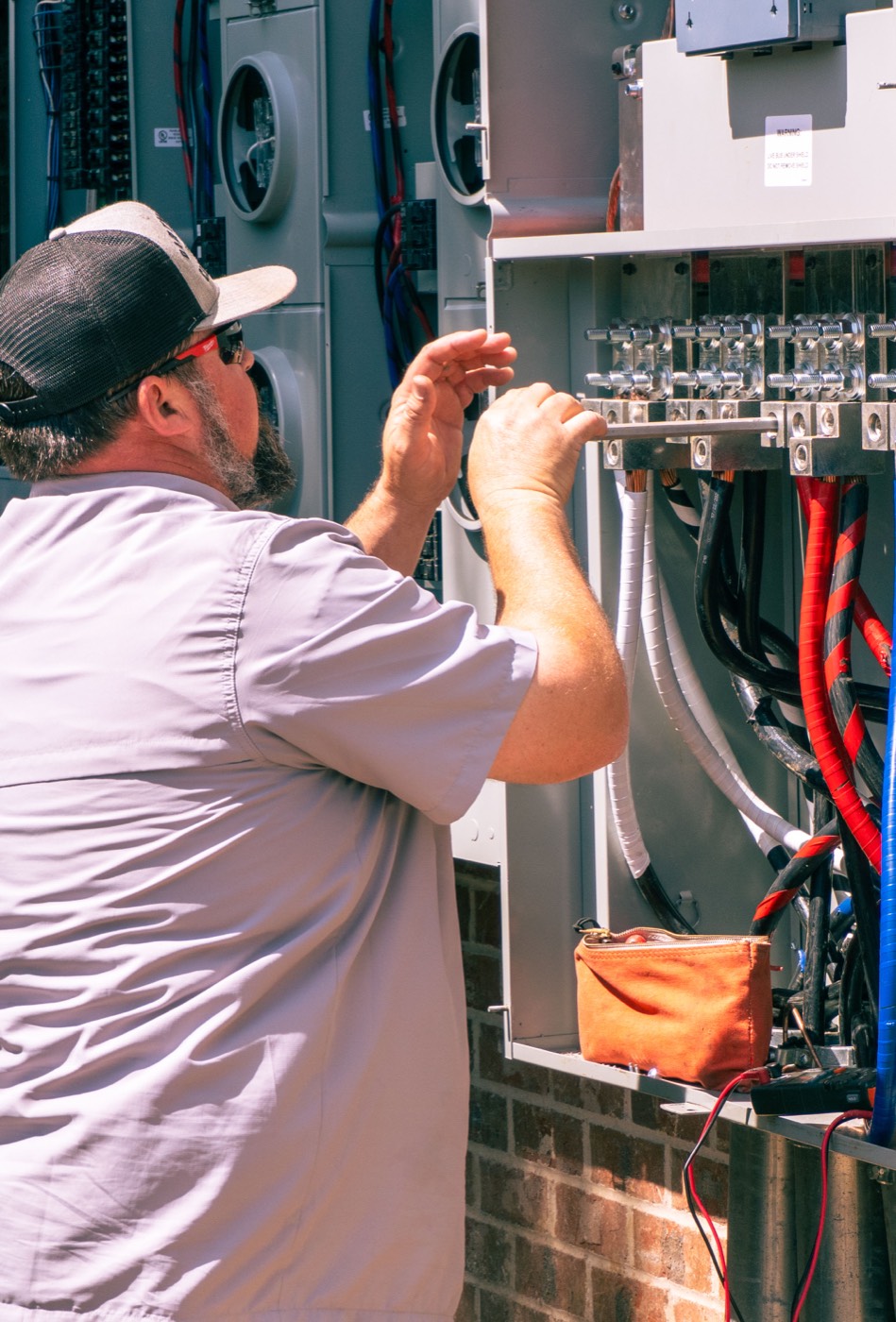 Electrician wiring a panel
